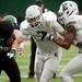 EMU defensive back Pudge Cotton pushes through the offensive line on Sunday, April 14. AnnArbor.com I Daniel Brenner